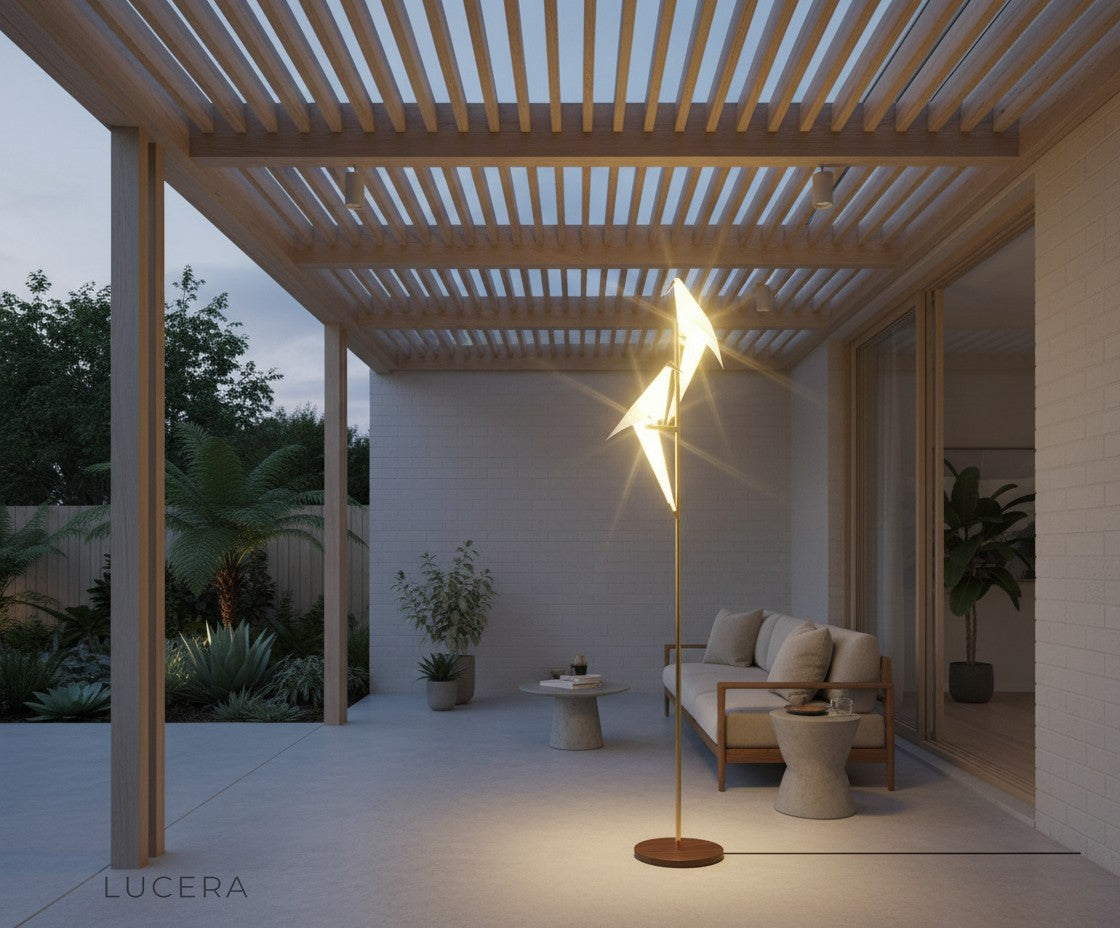 elegant evening scene of gold parrot floor lamp illuminating a chic lounge area with shadows