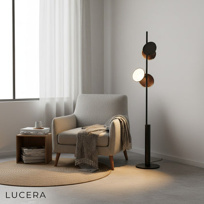 Nordic floor lamp next to sofa in minimalist living space with neutral tones