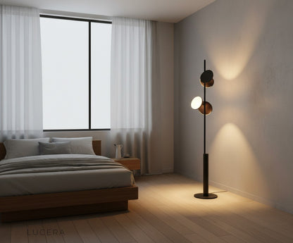Freienbach lamp glowing at dusk in modern entryway with wooden floor and mirror