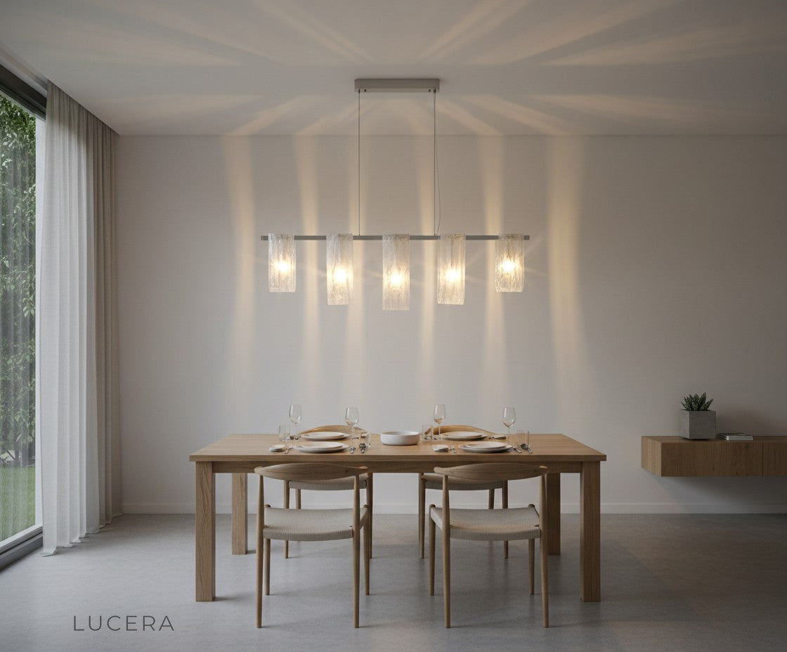 Sleek Fuchsia Liora glass pendant light paired with neutral decor in a bright Scandinavian-style room