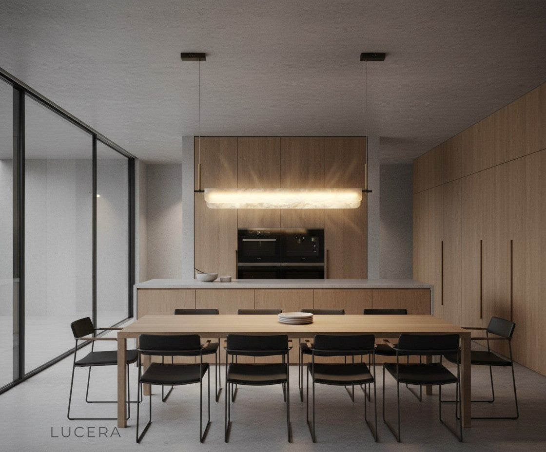 Linear pendant light over a bedside table in a stylish bedroom with soft evening lighting