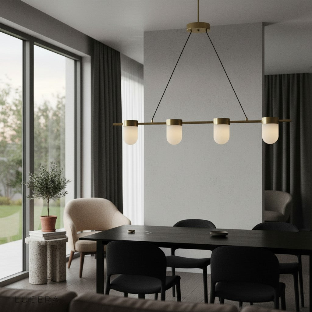Linear chandelier with alabaster shades in bright entryway with high ceiling