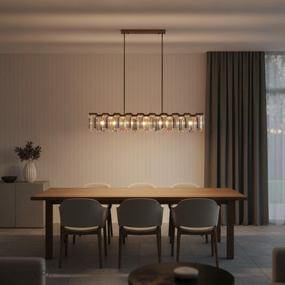 Nighttime shot of crystal linear light fixture illuminating a formal entertaining space