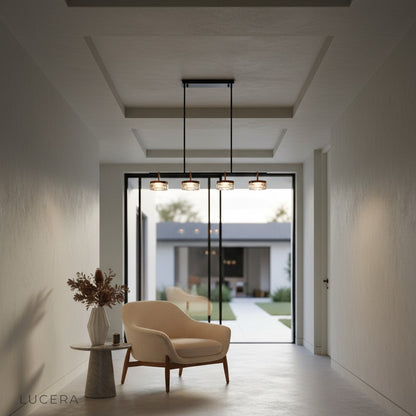 Elegant linear chandelier in open-concept kitchen at golden hour with natural light