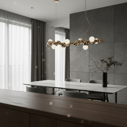 nighttime ambient shot of Byzantium chandelier glowing softly in cozy living room corner