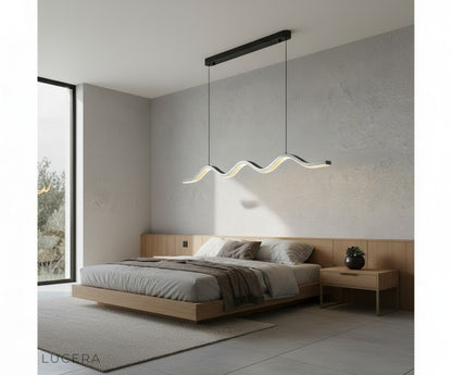 nighttime lifestyle shot of pearl black wave chandelier in elegant lounge with moody lighting