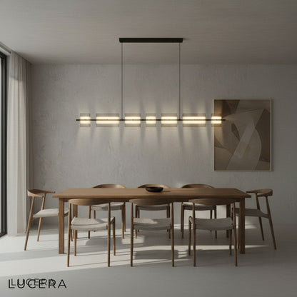 Modern chandelier with adjustable rods and copper accents in loft-style room