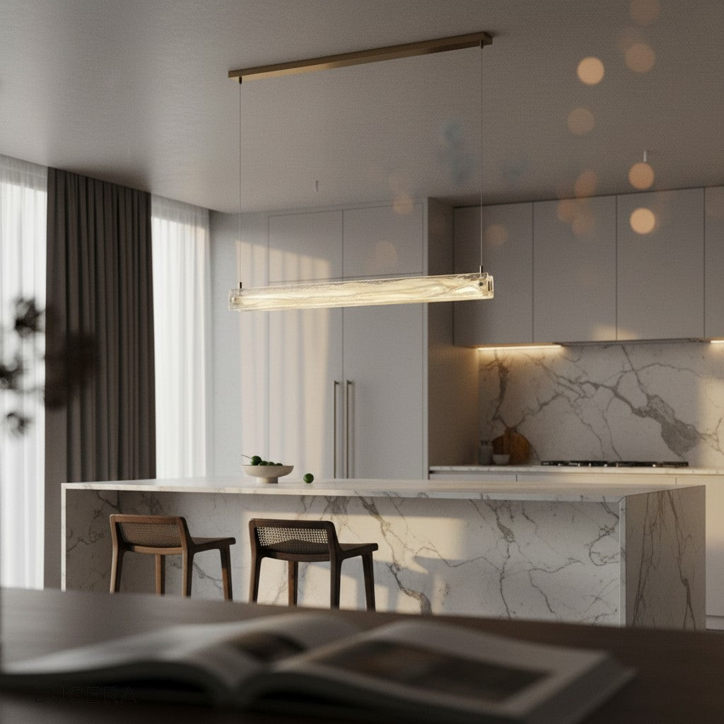 rectangular LED chandelier illuminating a long kitchen island with bar stools