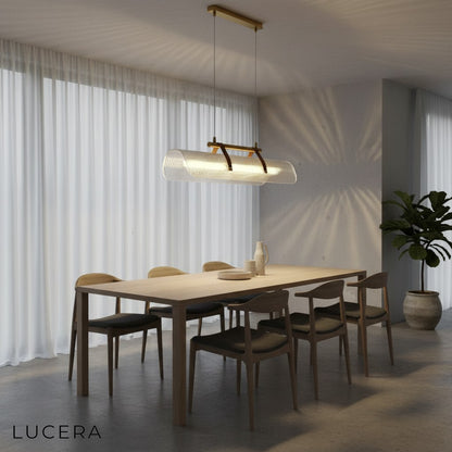 Naphthol rectangle chandelier in a sunlit entryway with concrete floor and wooden bench