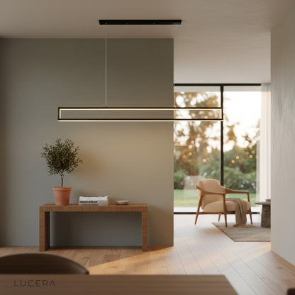 overhead angle of Ingrid chandelier showing its slim profile and even light distribution over a table