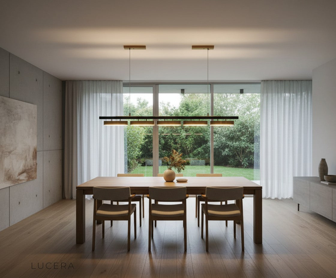 Nighttime lifestyle shot of Oskar LED chandelier casting geometric shadows on a white wall