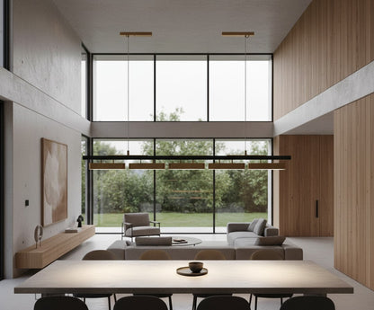 Oskar chandelier hanging above a round table in a compact apartment with minimalist decor