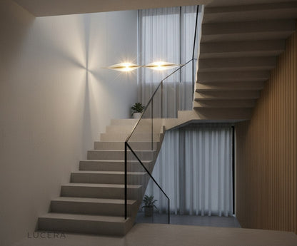 Brage spiral chandelier above bedside table in Nordic bedroom with soft dusk ambiance