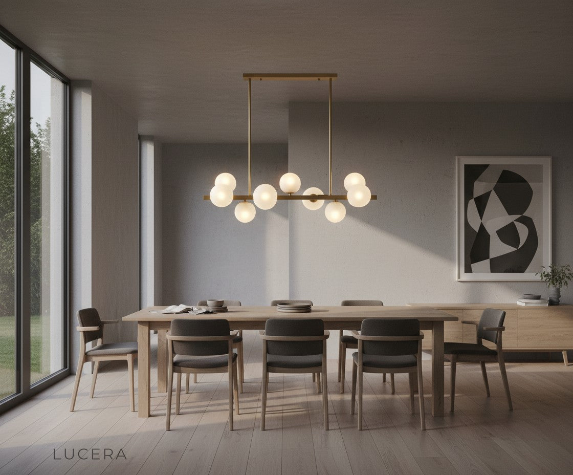 Ambient nighttime view of the chandelier in a modern hallway with reflective floor