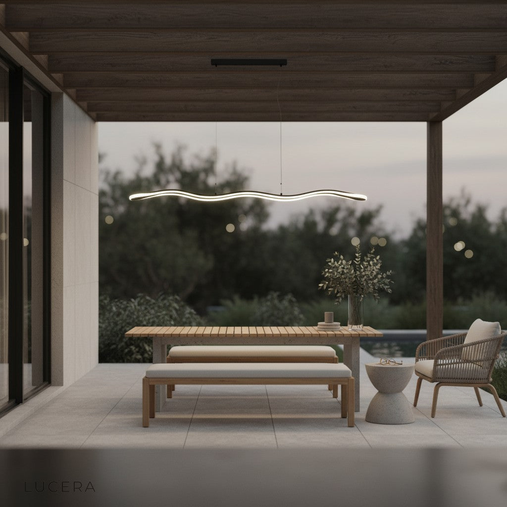 Skadi Wave LED lamp illuminating cozy dining nook with wooden table and plants