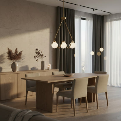 Gold and copper finish detail on Verdandi glass chandelier in bright studio lighting