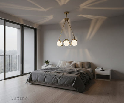 Lucera Verdandi gold copper chandelier in spacious loft with high ceiling