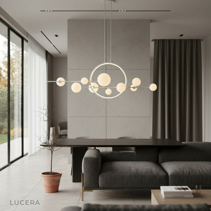 black iron and glass bubble chandelier hanging above round wooden dining table