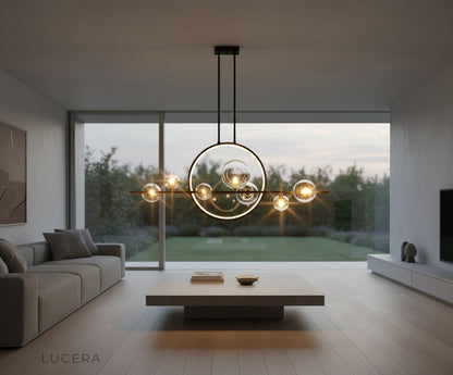 Vor chandelier in minimalist white dining space with pendant lights off and soft shadows