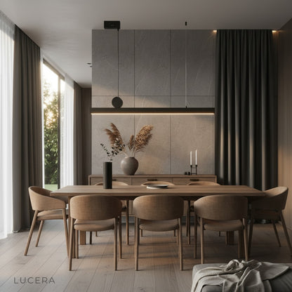 Angelo black chandelier glowing at dusk in a minimalist interior with ambient shadows
