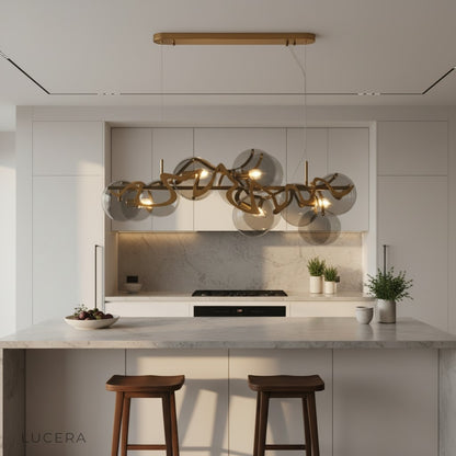 smoke-gray glass variant of Calmo chandelier lit warmly in contemporary living room