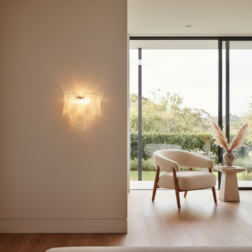 Pair of Carme Murano glass sconces flanking a mirror in a chic entryway with ambient daytime light