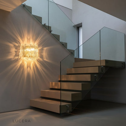 Cielo sconce ambient nighttime shot with soft light pooling on a dark painted wall