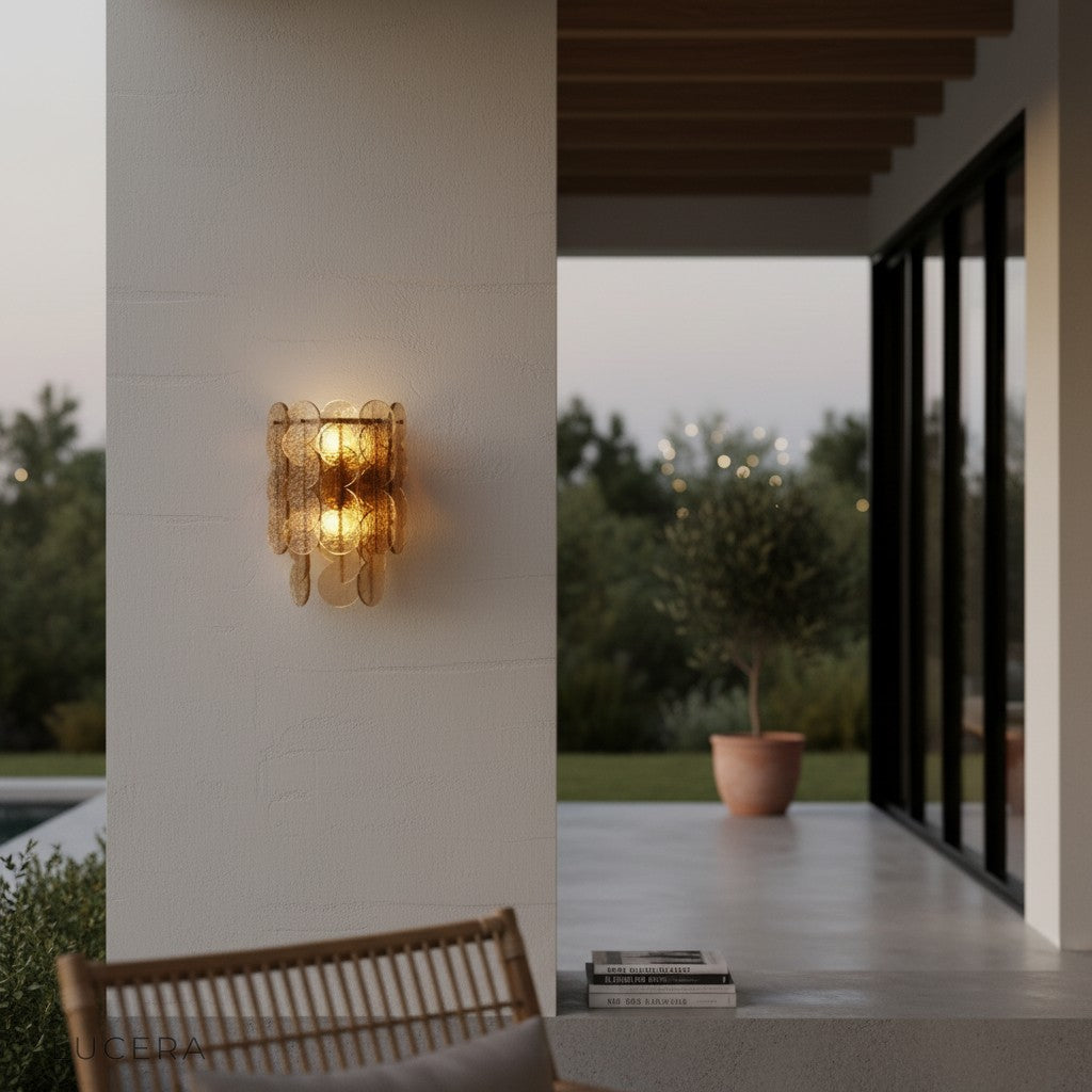 ambient evening shot of Colmo Caspian wall light illuminating hallway with cozy glow