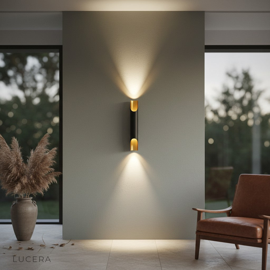 Crema Nordic wall lamp black gold paired with a leather chair in a contemporary reading nook