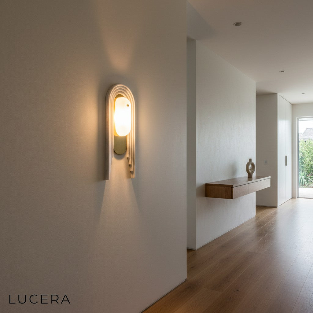 close-up of Cuore wall lamp solid brass frame and luxurious marble backplate details