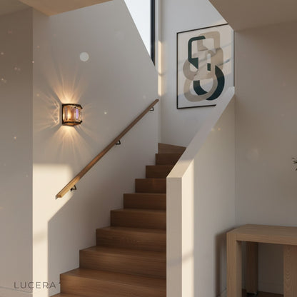 Dono Vibrant Prism Wall Sconce in modern bedroom ambient lighting with warm bronze glow and crystal sparkle
