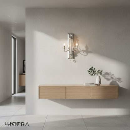Nighttime lifestyle shot of gold wall sconce glowing in modern rustic lounge