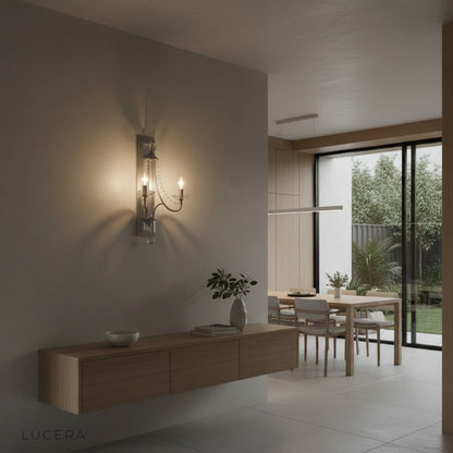 Vintage-inspired wall sconce with crystal drops in warm ambient bedroom corner