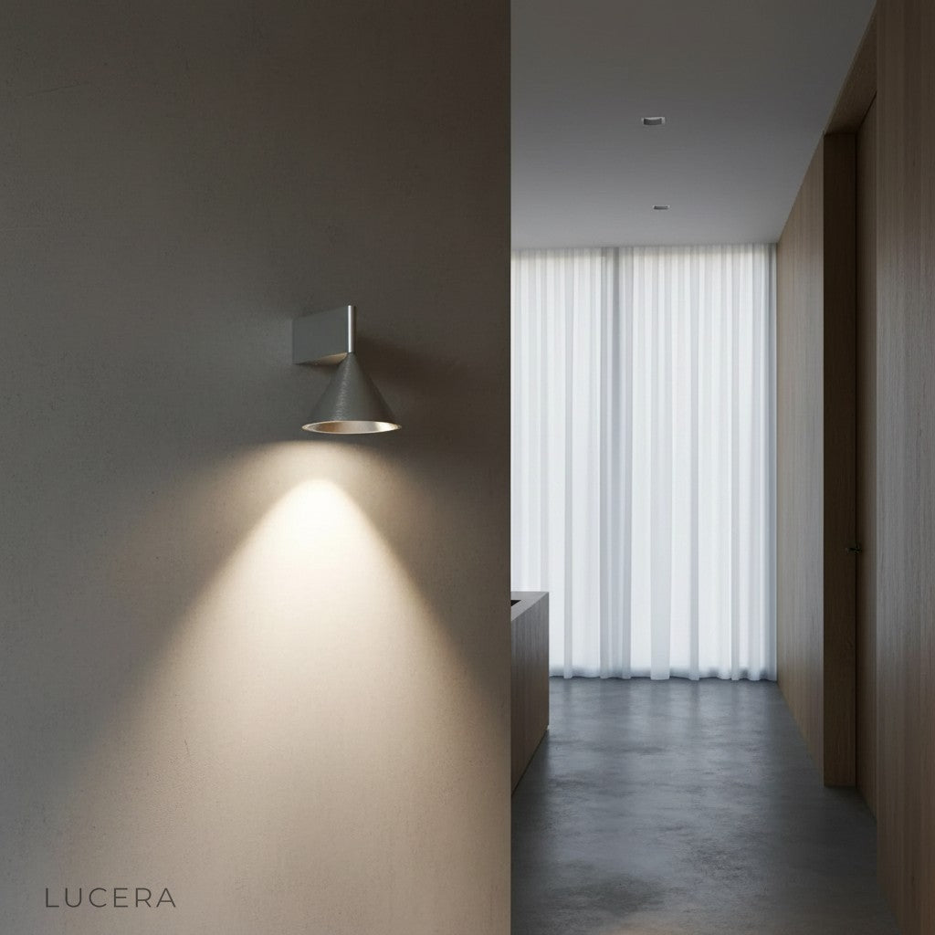 Three-color LED wall lamp in warm tone beside minimalist sofa