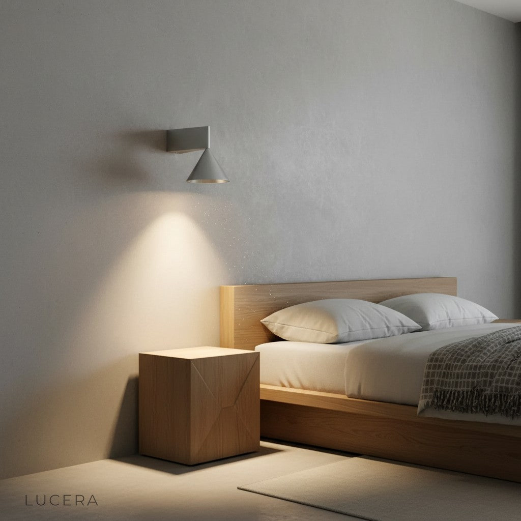 Nighttime ambient shot of cone sconce casting soft shadows