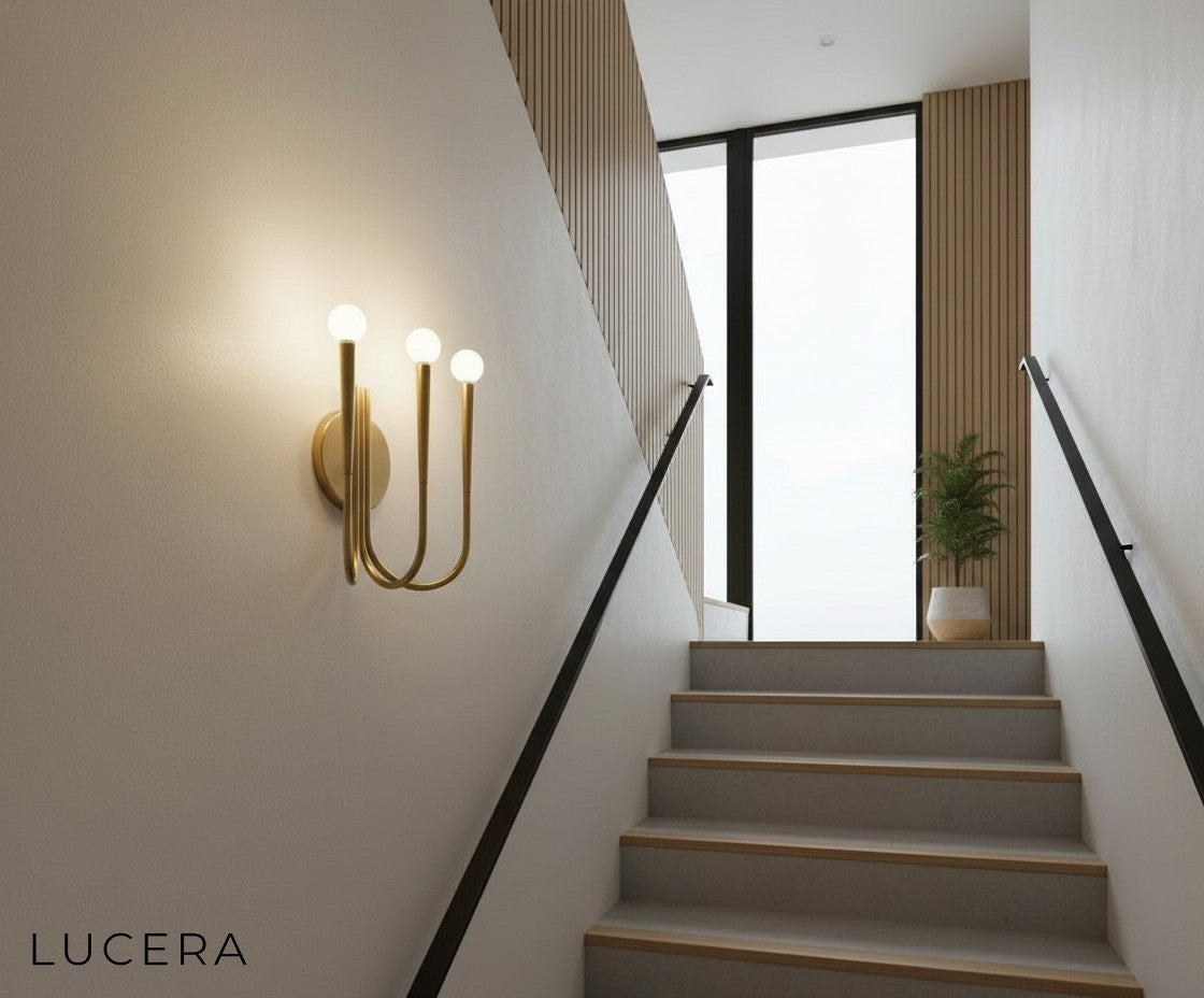 Fiore Art-Deco wall sconce in black finish paired with velvet furniture in a stylish lounge
