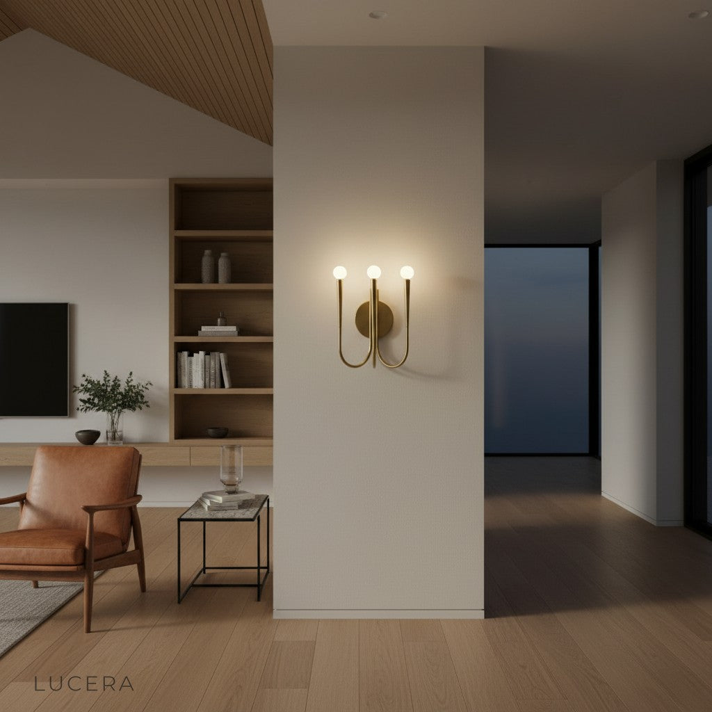 Nighttime lifestyle shot of Fiore Art-Deco LED sconce glowing above a sideboard in a chic dining room