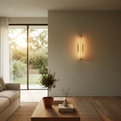 Forte Retro wall sconce at dusk with soft shadowless light in a modern interior