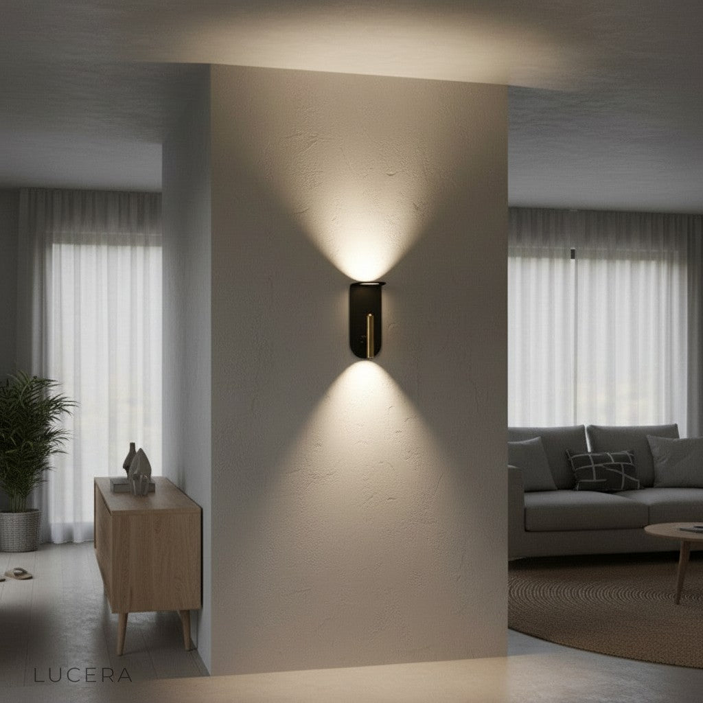 compact wall sconce with gold accents highlighting textured wall in contemporary lounge