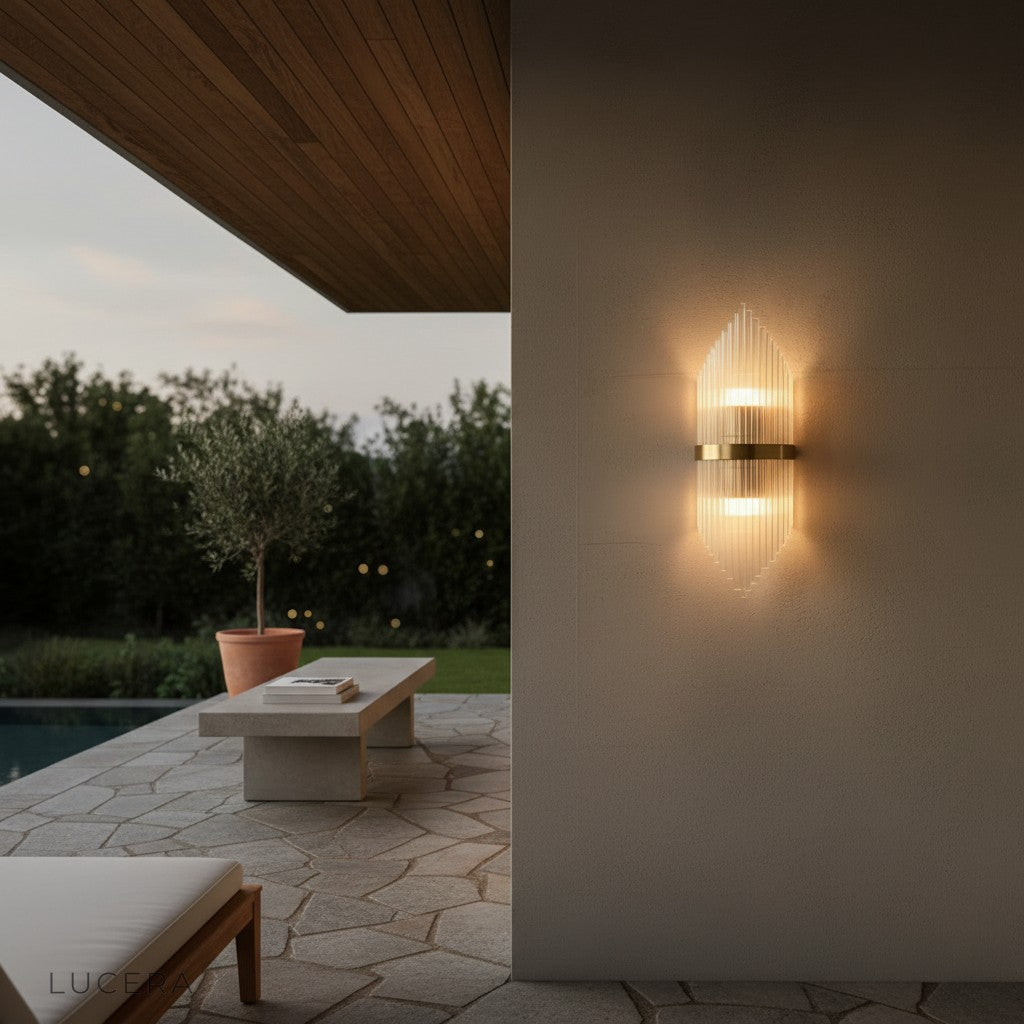 Lento gold wall light paired with neutral decor in a contemporary entryway