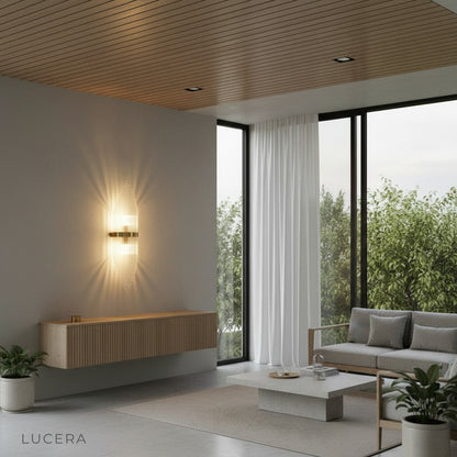 Lento wall sconce in a chic hotel-style lounge with cool and warm light mix