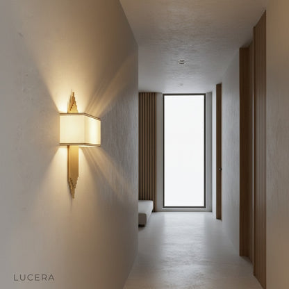 Leone fabric shade sconce at dusk in entryway with warm inviting light