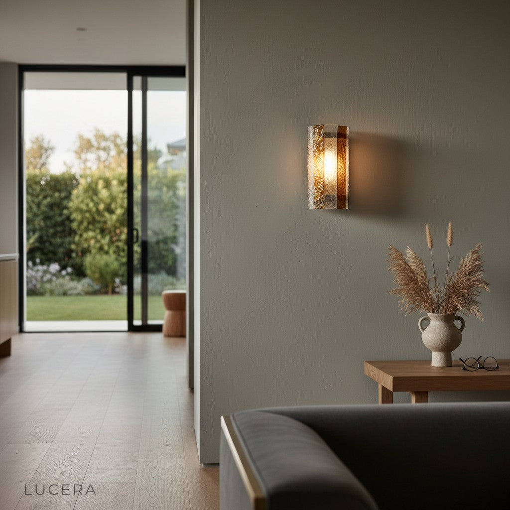 Luce wall lamp with warm ambient glow illuminating a cozy bedroom nightstand