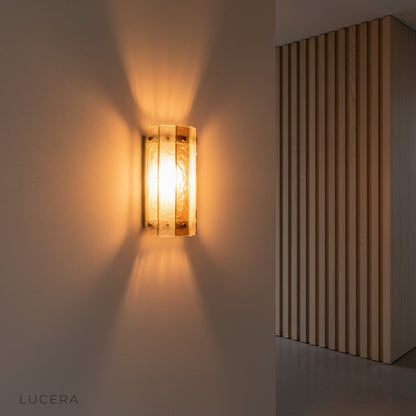 Retro French wall lamp casting soft glow in a rustic farmhouse-style hallway