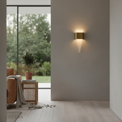 angled studio view of Lucera Passo LED wall light with curved shark tooth silhouette
