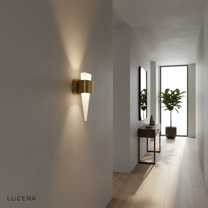 Passo Shark Tooth LED wall light glowing in a spa-like bathroom with stone tiles and towels