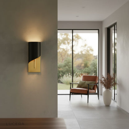 Pair of Duomo copper sconces flanking a vintage mirror in a retro-inspired bedroom