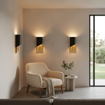 Duomo modern copper sconce above a mid-century console table in a stylish entryway