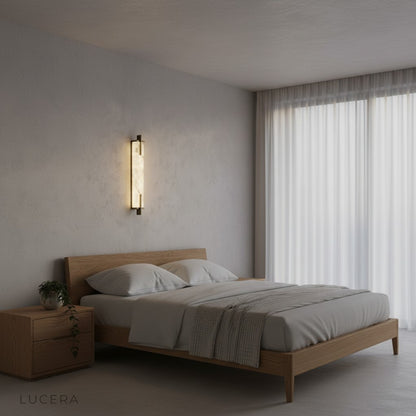 Amalfi iron lamp above a bed in a serene minimalist bedroom setting