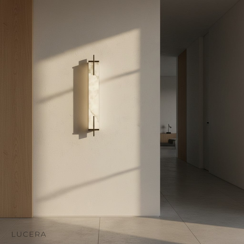 Nighttime lifestyle shot of Amalfi wall lamp illuminating a dark accent wall